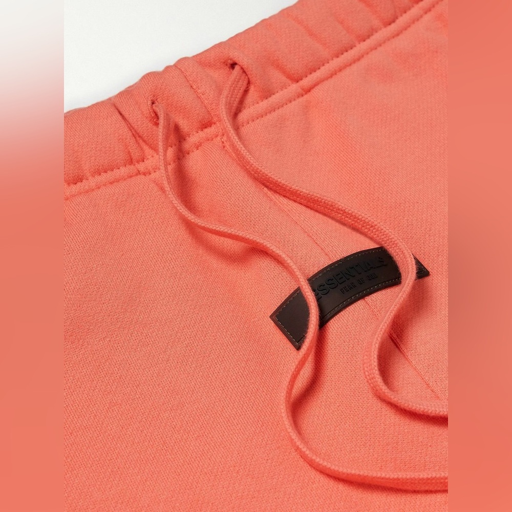 FEAR OF GOD ESSENTIALS - Tapered Logo Blend Jersey Sweatpants in Coral - Picture 3 of 11